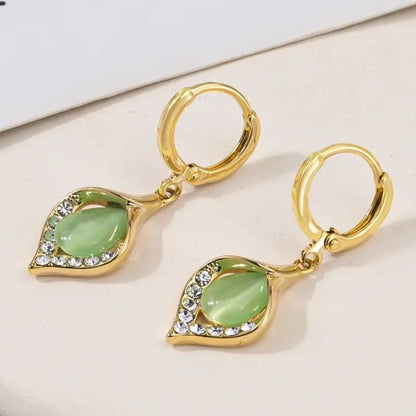 Nuevos pendientes de piedra ojo de gato con detalles de diamantes