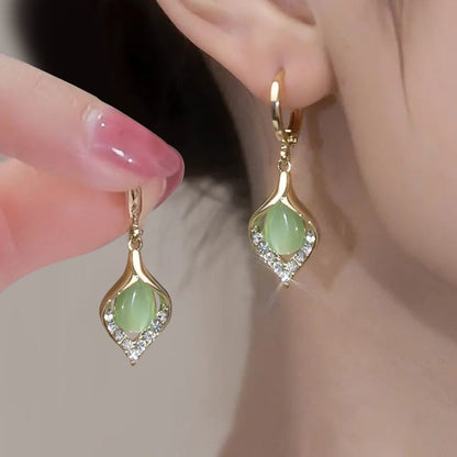 Nuevos pendientes de piedra ojo de gato con detalles de diamantes